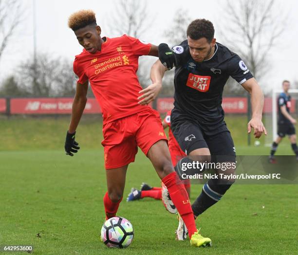 Kane Lewis of Liverpool and Mason Bennett of Derby County in action during the Liverpool v Drby County Premier League 2 game at The Academy on...