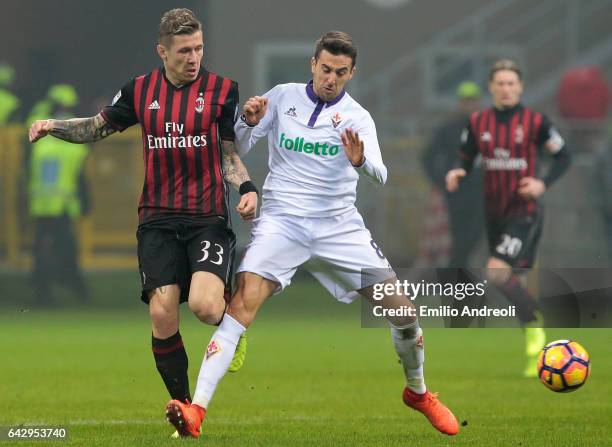 Juraj Kucka of AC Milan competes for the ball with Matias Vecino of ACF Fiorentina during the Serie A match between AC Milan and ACF Fiorentina at...
