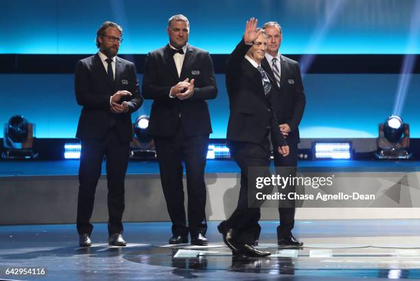 Top 100 players Peter Forsberg, Eric Lindros, Joe Sakic and Joe Nieuwendyk stand onstage during the NHL 100 presented by GEICO show as part of the...