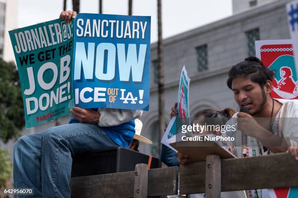 Protesters at a pro-immigration rally where organizers called for a stop to the Immigration and Customs Enforcement raids and deportations of illegal...