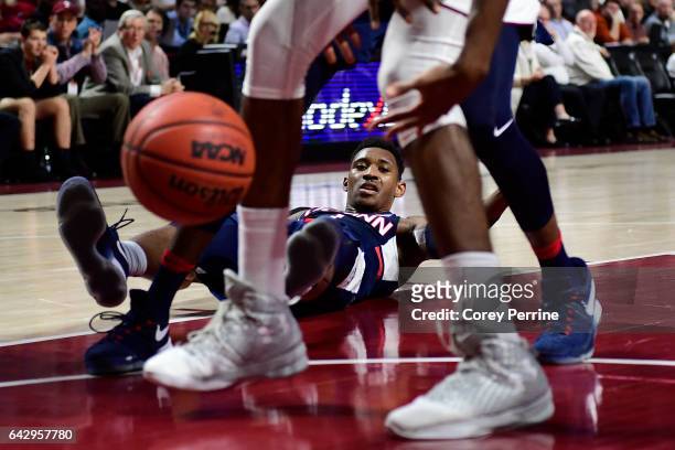 Christian Vital of the Connecticut Huskies looses the ball and his footing against the Temple Owls during the first half at the Liacouras Center on...