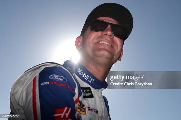 Clint Bowyer, driver of the Mobil 1 Ford, sits on pit wall during qualifying for the Monster Energy NASCAR Cup Series 59th Annual DAYTONA 500 at...