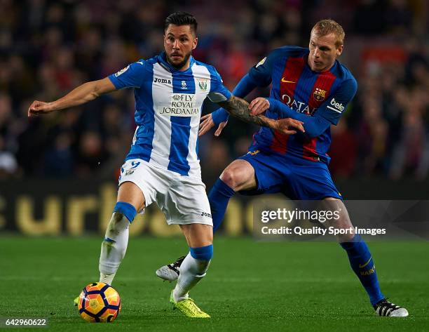 Jeremy Mathieu of Barcelona competes for the ball with Miguel Angel Guerrero of Leganes during the La Liga match between FC Barcelona and CD Leganes...
