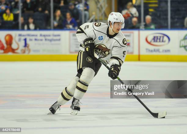 Christian Djoos of the Hershey Bears brings the puck up ice during a game against the Bridgeport Sound Tigers at the Webster Bank Arena on February...