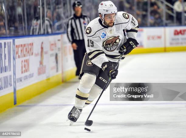 Riley Barber of the Hershey Bears brings the puck up ice during a game against the Bridgeport Sound Tigers at the Webster Bank Arena on February 19,...