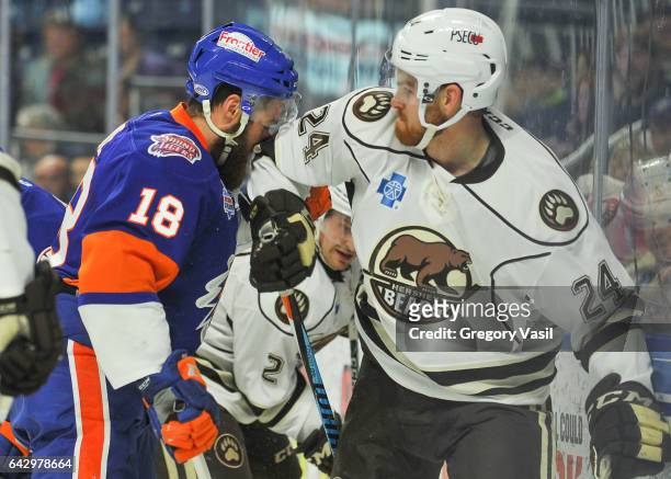 Andrew Rowe of the Bridgeport Sound Tigers is hit with an elbow from Brad Malone of the Hershey Bears during a game at the Webster Bank Arena on...