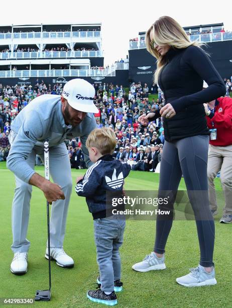 Dustin Johnson celebrates his win with wife Paulina Gretzky and son Tatum on the 18th green during the final round at the Genesis Open at Riviera...