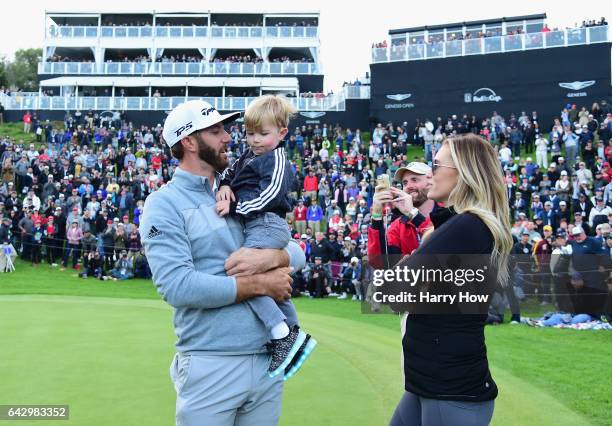 Dustin Johnson celebrates his win with wife Paulina Gretzky and son Tatum on the 18th green during the final round at the Genesis Open at Riviera...