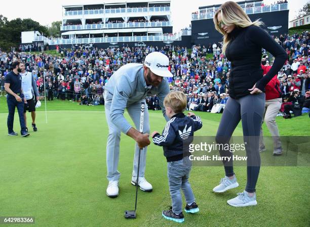 Dustin Johnson celebrates his win with wife Paulina Gretzky and son Tatum on the 18th green during the final round at the Genesis Open at Riviera...