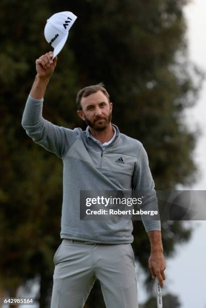 Dustin Johnson celebrates his win on the 18th hole during the final round at the Genesis Open at Riviera Country Club on February 19, 2017 in Pacific...