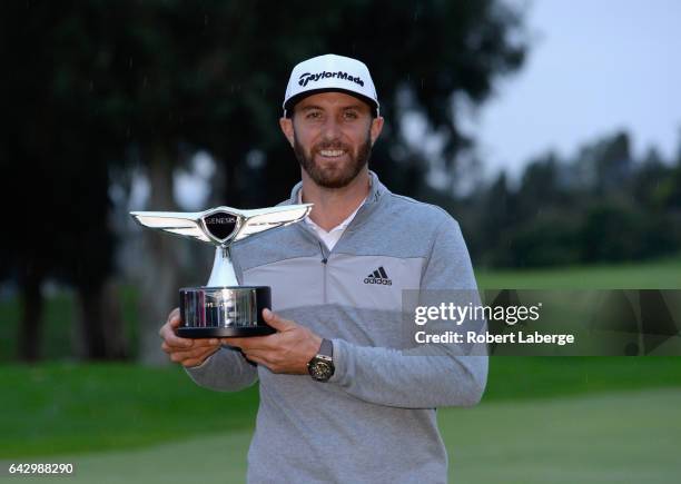 Dustin Johnson poses with the trophy during the final round at the Genesis Open at Riviera Country Club on February 19, 2017 in Pacific Palisades,...