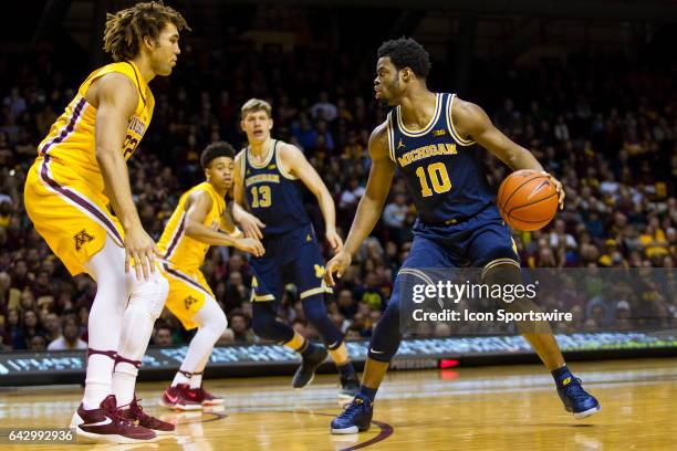 Michigan Wolverines guard Derrick Walton Jr. In action during the Big Ten Conference game between the Michigan Wolverines and the Minnesota Golden...