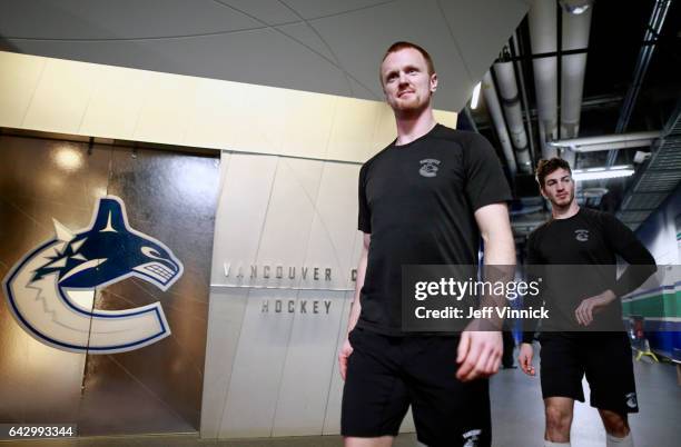 Henrik Sedin and Jayson Megna of the Vancouver Canucks walk to their dressing room before their NHL game against the Philadelphia Flyers at Rogers...