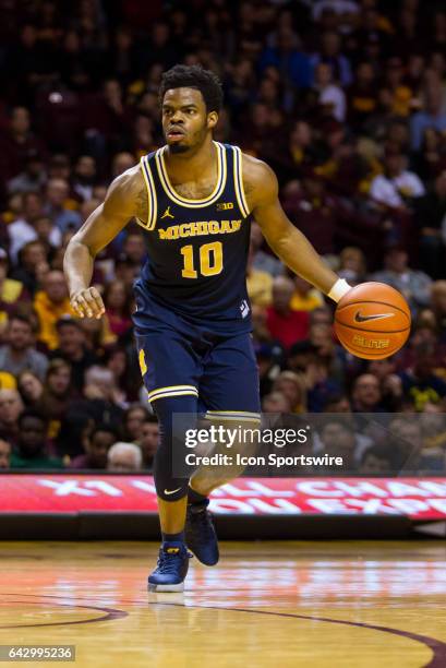 Michigan Wolverines guard Derrick Walton Jr. In action during the Big Ten Conference game between the Michigan Wolverines and the Minnesota Golden...