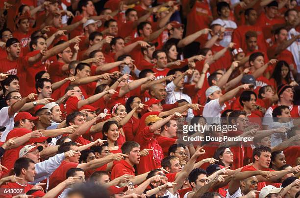 Fans of the University of Maryland Terrapins scream and point at the other team from the student section during the ACC basketball game against the...