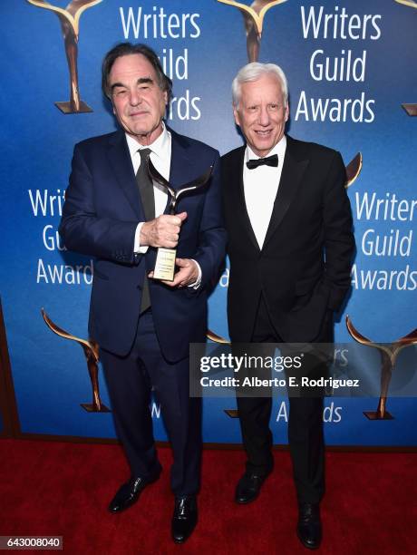 Screenwriter /Director Oliver Stone and actor James Woods pose with the Laurel Award for Screenwriting Achievement during the 2017 Writers Guild...