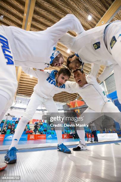 Team Italy's Marco Fichera, Enrico Garozzo, Paolo Pizzo, Andrea Santarelli huddle together before the start of a match during team competition at the...