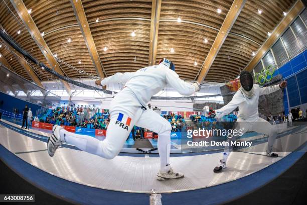Yannick Borel of France fences Paolo Pizzo of Italy during the bronze medal match in team competition at the Peter Bakonyi Senior Men's Epee World...