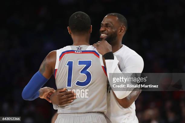Paul George of the Indiana Pacers hugs LeBron James of the Cleveland Cavaliers during the 2017 NBA All-Star Game at Smoothie King Center on February...