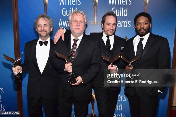 The People vs. O.J. Simpson: American Crime Story' writers pose with the award for Adapted Long Form Award at the 2017 Writers Guild Awards L.A....