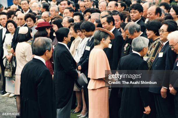 Emperor Akihito, Empress Michiko, Crown Prince Naruhito, Crown Princess Masako and Princess Sayako talk with guests during the Autumn Garden Party at...