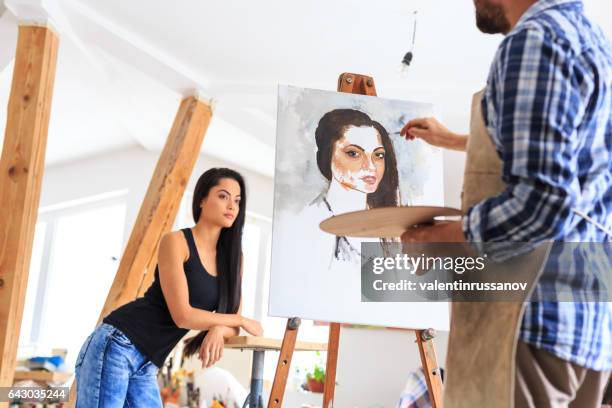 artist making portrait of young woman - artist portrait stock pictures, royalty-free photos & images