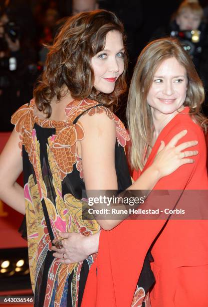 Maggie Gyllenhaal and Julia Jentsch arrive for the closing ceremony of the 67th Berlinale International Film Festival Berlin at Berlinale Palace on...