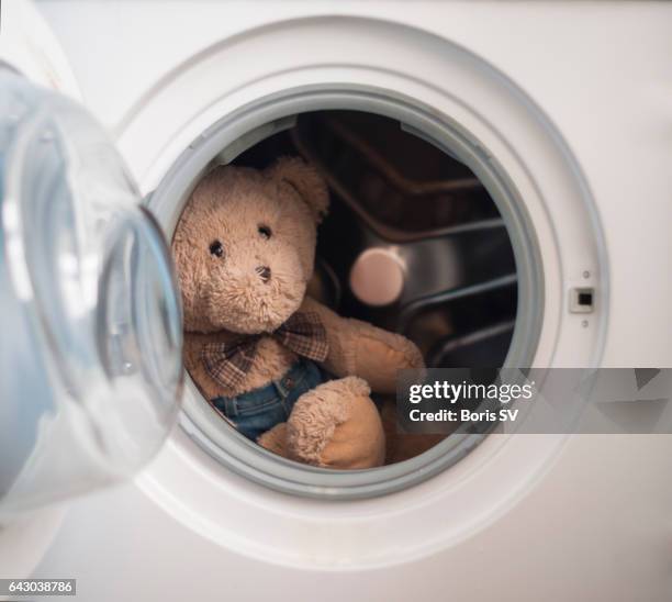 teddy bear in the washing machine - washing machine front stock pictures, royalty-free photos & images