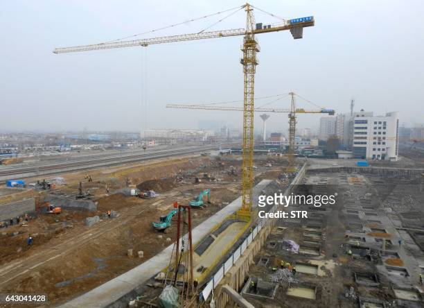 This photo taken on February 16, 2017 shows a construction site in Lianyungang, China's Jiangsu province. Chinese banks lent more money in January...