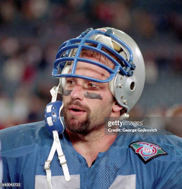 Linebacker Chris Spielman of the Detroit Lions looks on from the field after a game against the Minnesota Vikings at the Pontiac Silverdome on...