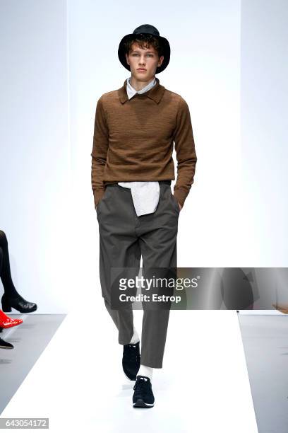 Model walks the runway at the Margaret Howell show during the London Fashion Week February 2017 collections on February 19, 2017 in London, England.