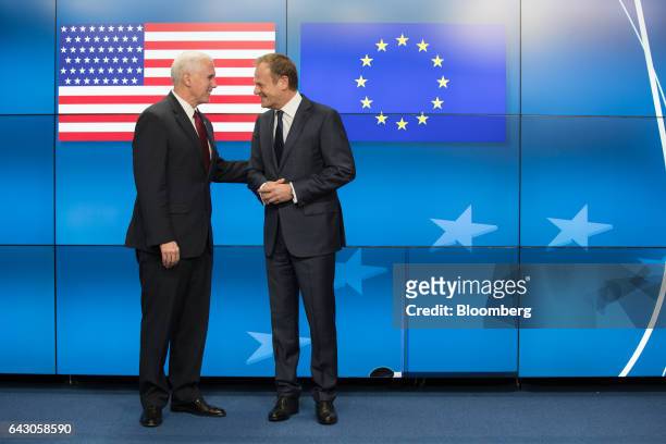 Vice President Mike Pence, left, is greeted by Donald Tusk, president of the European Union , ahead of a meeting at the Europa building in Brussels,...