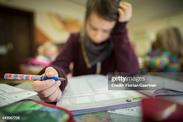 Student reads concentrated during the lesson. Feature at a school in Goerlitz on February 03, 2017 in Goerlitz, Germany.