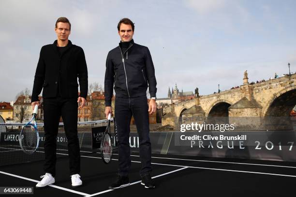 Roger Federer of Switzerland and Tomas Berdych of The Czech Republic pose for photos in front of the Charles Bridge during the countdown to the...