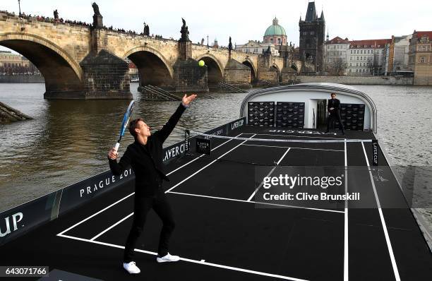 Roger Federer of Switzerland in action against Tomas Berdych of The Czech Republic in front of the Charles Bridge during the countdown to the...