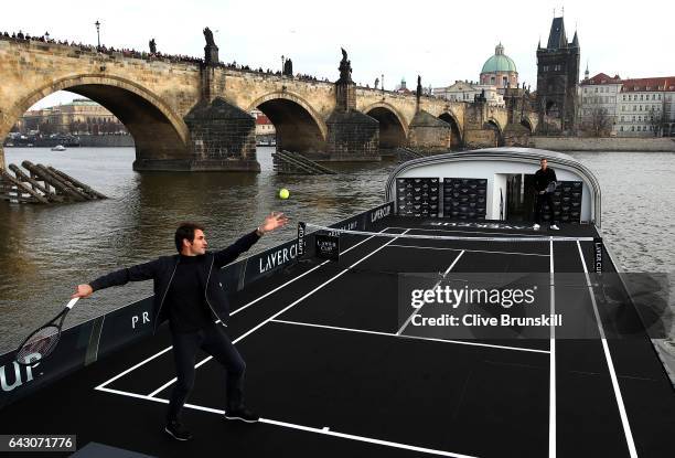 Roger Federer of Switzerland in action against Tomas Berdych of The Czech Republic in front of the Charles Bridge during the countdown to the...