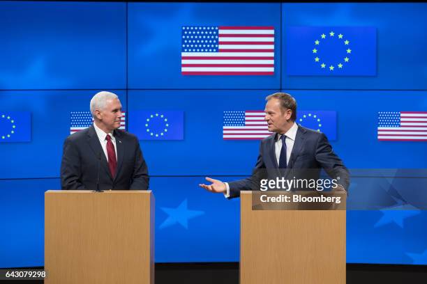 Donald Tusk, president of the European Union , right, gestures whiles speaking beside U.S. Vice President Mike Pence, during a news conference at the...