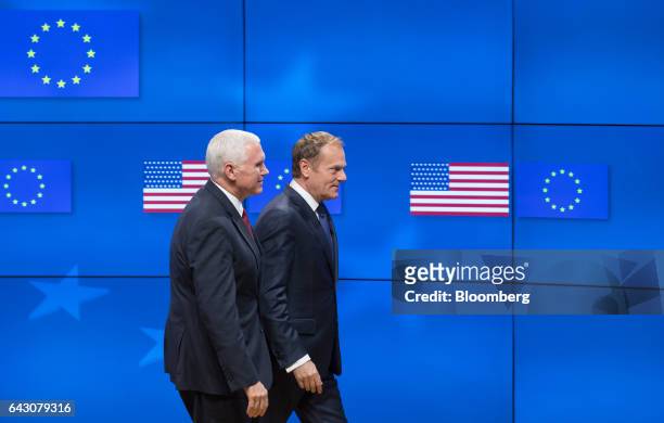 Vice President Mike Pence, left, and Donald Tusk, president of the European Union , depart after a news conference at the Europa building in...