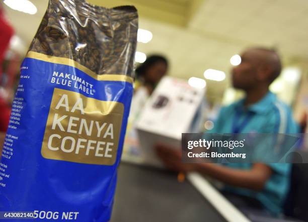 Bag of Nakumatt blue label AA kenya coffee sits on a conveyor belt at the check-out area inside a Nakumatt Holdings Ltd. Supermarket in Nairobi,...