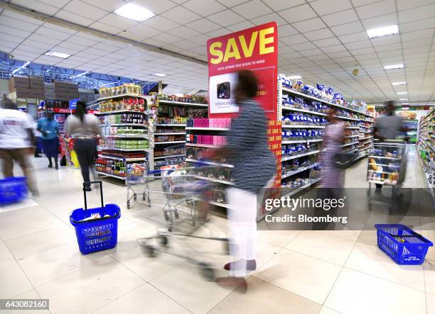 Customers browse the product aisles inside a Nakumatt Holdings Ltd. Supermarket in Nairobi, Kenya, on Saturday, Feb. 18, 2017. Nakumatt is Kenya's...