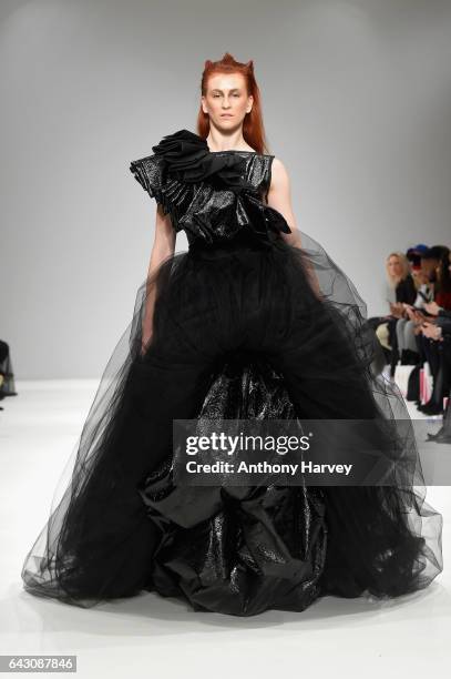 Model walks the runway at the Hellavagirl show during the London Fashion Week February 2017 collections on February 20, 2017 in London, England.