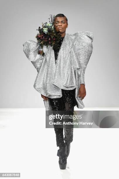 Model walks the runway at the Hellavagirl show during the London Fashion Week February 2017 collections on February 20, 2017 in London, England.