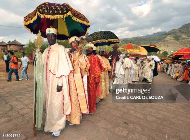 Ethiopian Orthodox Christian priests and monks line up during the annual festival of Timkat in Lalibela, Ethiopia which celebrates the Baptism of...