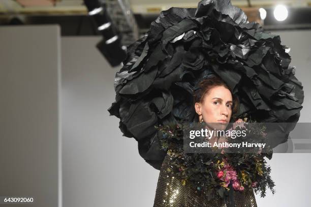 Model walks the runway at the Hellavagirl show during the London Fashion Week February 2017 collections on February 20, 2017 in London, England.