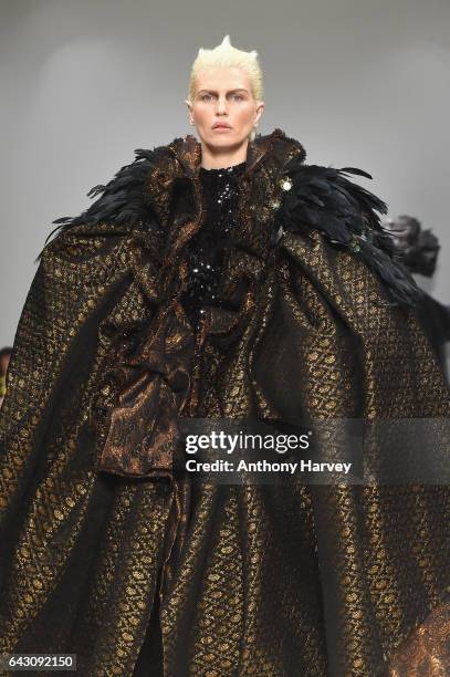 Model walks the runway at the Hellavagirl show during the London Fashion Week February 2017 collections on February 20, 2017 in London, England.