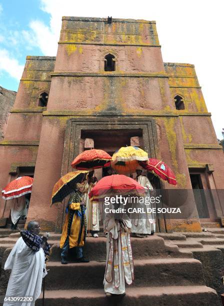 Ethiopian Orthodox Christian priests and monks leave mass at the Bete Giyorgis rock-hewn church during the annual festival of Timkat in Lalibela, on...