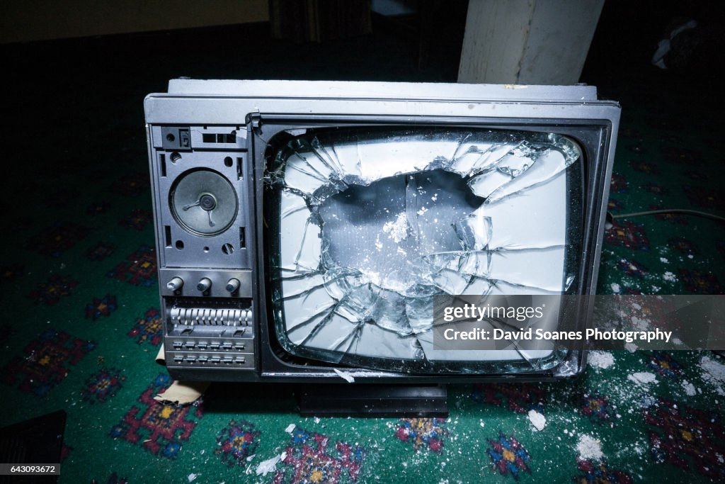 A smashed television on the ground