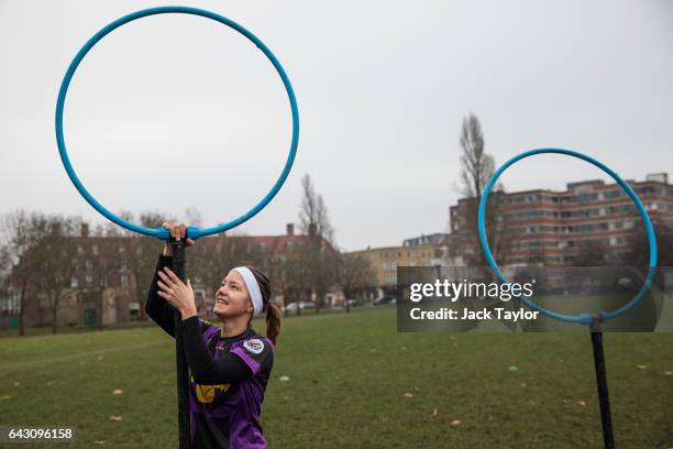 Quidditch players Eva Verpe sets up the hoops before the Crumpet Cup quidditch tournament on Clapham Common on February 18, 2017 in London, England....