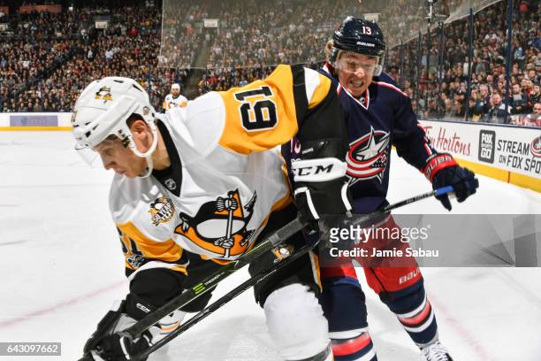 Steve Oleksy of the Pittsburgh Penguins and Cam Atkinson of the Columbus Blue Jackets battle for position on February 17, 2017 at Nationwide Arena in...