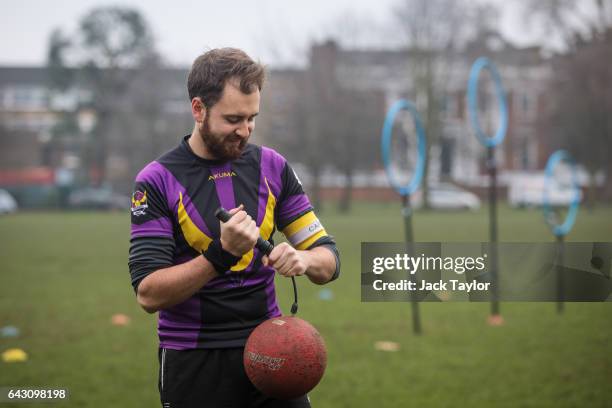 Quidditch player Matt Bateman pumps up a dodgeball known as a bludger before the Crumpet Cup quidditch tournament on Clapham Common on February 18,...